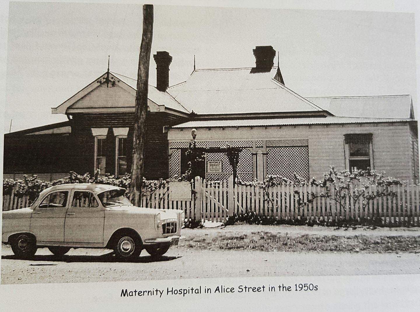 Weatherboard cottage with picket fence — the Barraba maternity hospital, 1950s